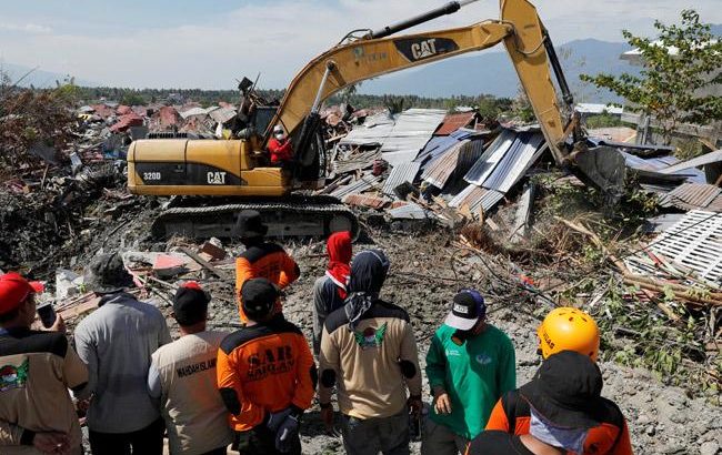 Bodies of mother clutching baby found as Indonesia quake toll rises above 1,500
