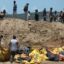 Indonesia earthquake and tsunami: Dead buried in mass grave